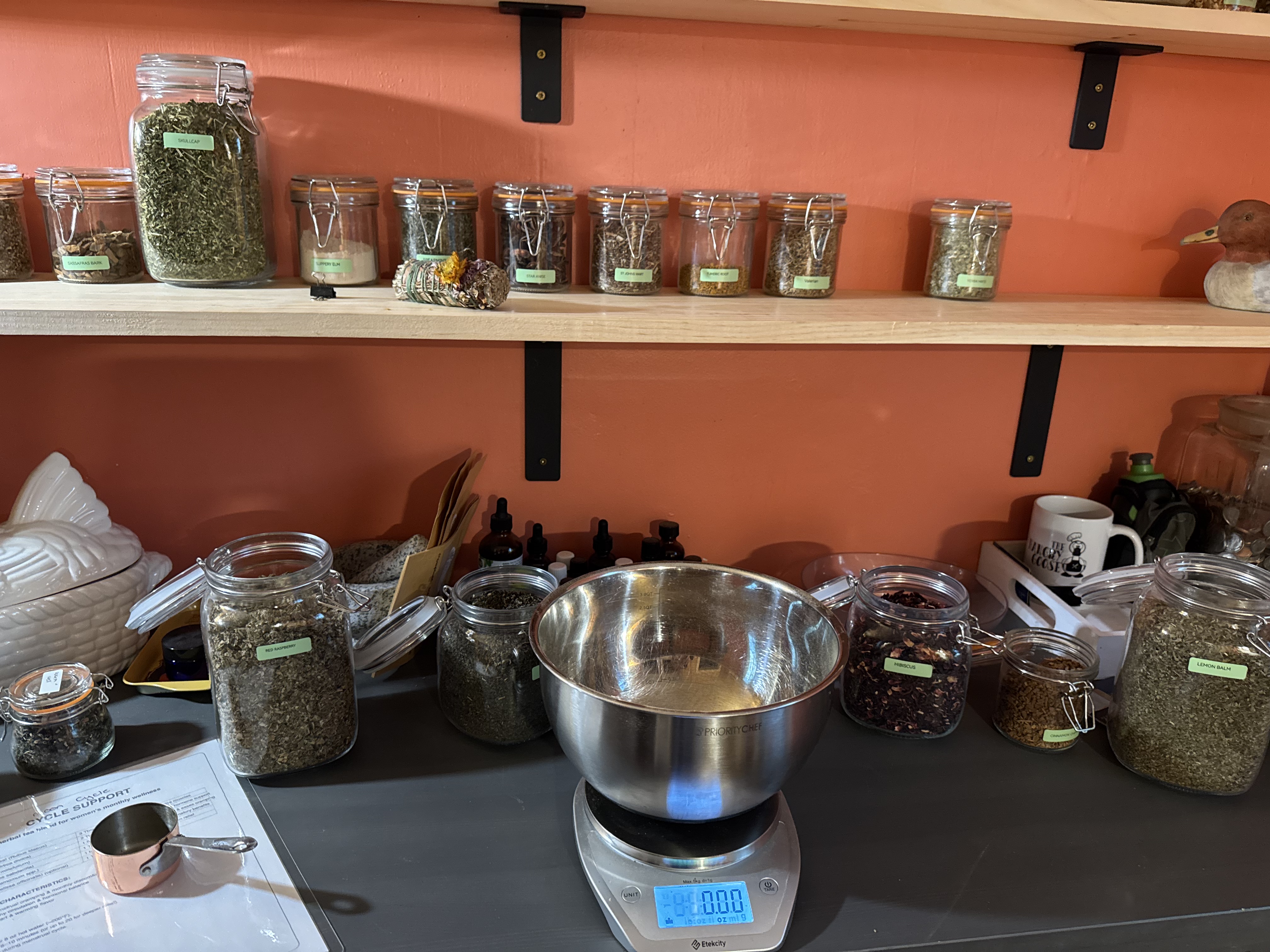 Apothecary workspace with herbs and jars